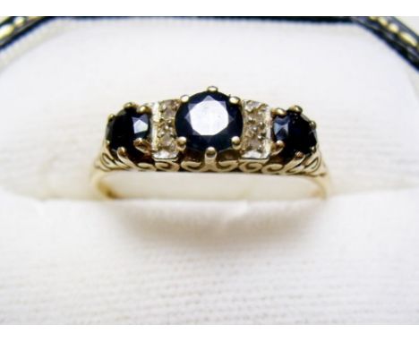 A 9 carat gold sapphire and diamond ring