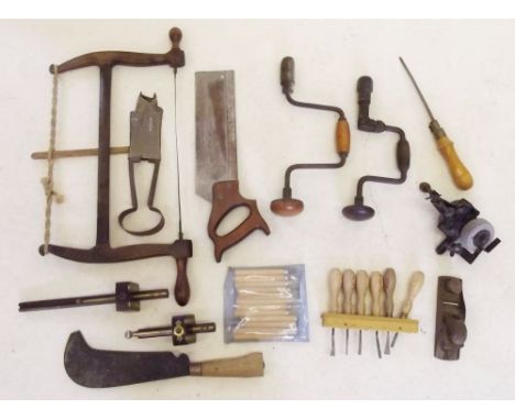 A bow saw and other woodworkers tools