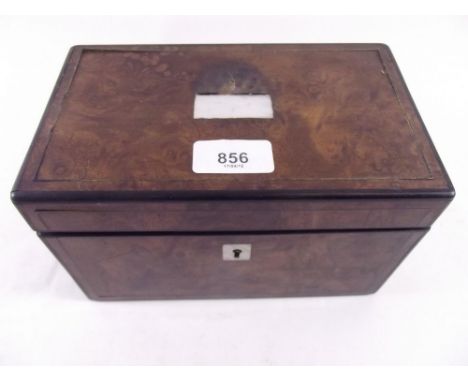 A Victorian burr walnut and mother of pearl inlaid tea caddy with fitted tea caddies within