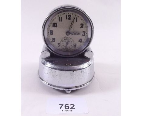 An Art Deco chrome alarm clock 
