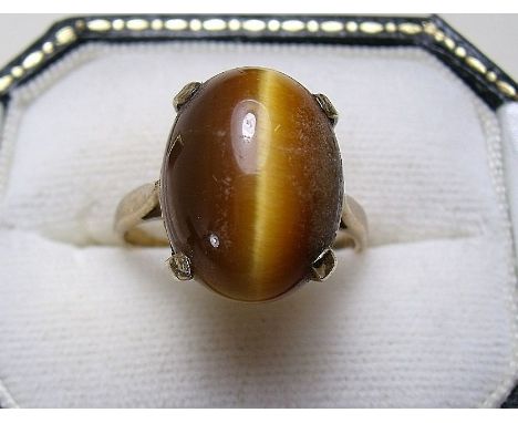 A 9 carat gold tigers eye ring
