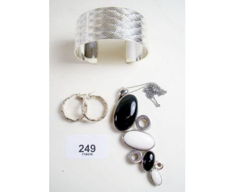 A silver bangle, silver necklace and pair of earrings - 86g