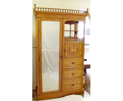 A Victorian satin ash Beaconsfield wardrobe with spindle gallery top over mirrored recess, hanging section , cupboard and dra