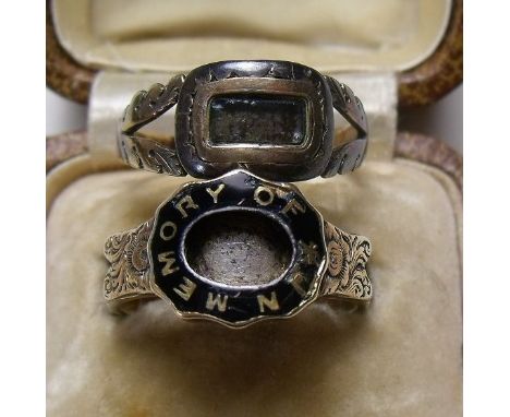 A Victorian gold and black enamel Momento Mori ring 1859 and another similar ring