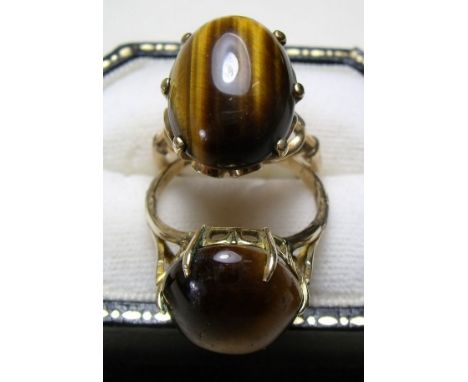 A 14 carat gold tigers eye ring and a 9 carat gold one