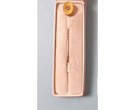 An 18 carat gold stick pin set diamond