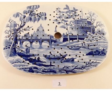 A Victorian Spode blue and white strainer dish decorated river scene with boats and buildings