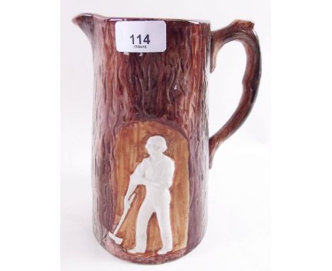 A Victorian trunk form pottery jug decorated wood cutter
