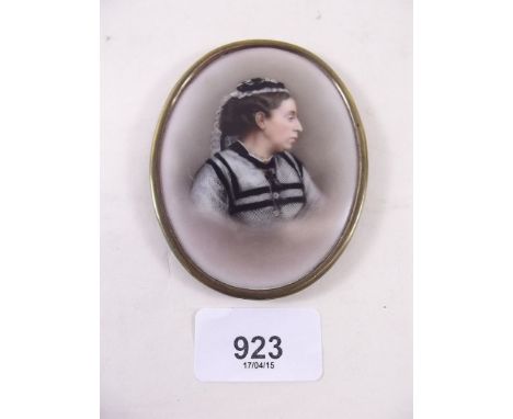 A Victorian oval porcelain miniature painted portrait of a lady in mourning 