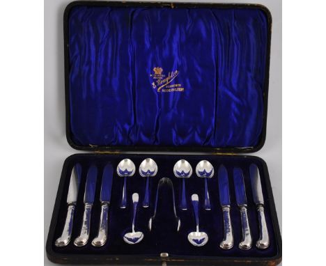 A set of Art Nouveau silver flatware comprising 6 knives, 6 spoons and tongs in original fitted case, Sheffield 1903, by Henr