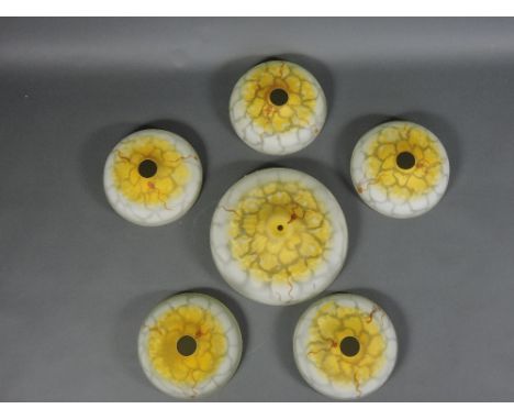 One large and five smaller early 20th Century lamp shades of opaque mottled white and yellow moulded glass, largest dia. 30cm