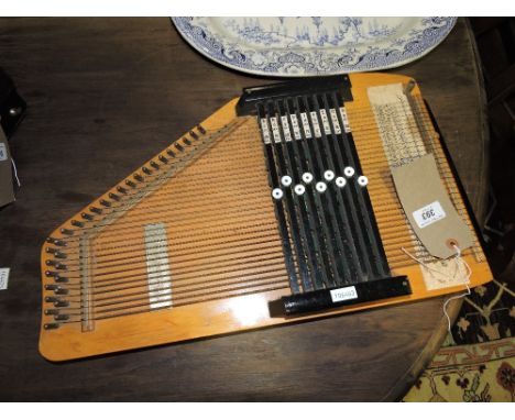 A table harp of customary form with applied plaque reading 'Choir Harp'