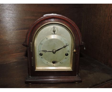 A miniature bracket clock, wooden cased, with a silvered dial, 8 day with Westminster chimes by Gustav Becker, circa 1930