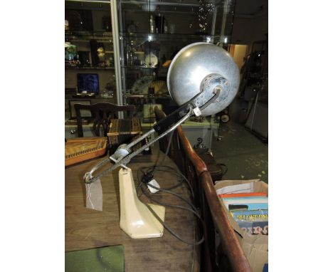 A vintage anglepoise lamp on cast iron base