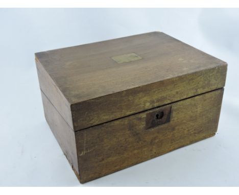 An early 20th Century writing slope with embossed velvet pad, pen tray, and brass-lidded inkwell