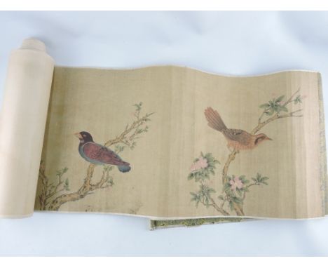 A Chinese scroll depicting birds amongst foliage.