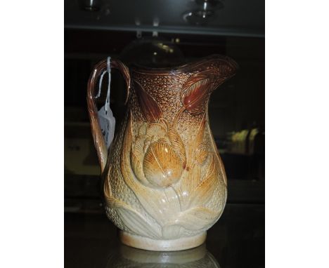 A framed circular pot lid, a 'harvest' cream jug, a crackle ware bottle, a ceramic feeder and a wooden sphere