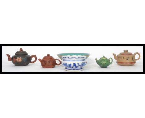 A collection of 20th century Oriental ceramic Yi Xing teapots along with two Chinese ceramic bowls. Largest measures 21 cm di