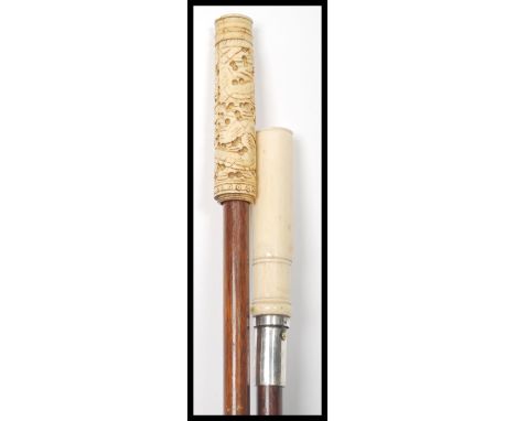 Two early 20th century walking stick canes waving tapering shafts with faux ivory handles.