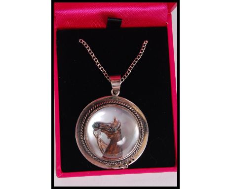 A silver Essex crystal necklace pendant depicting a horse on a silver chain. Complete in presentation box.