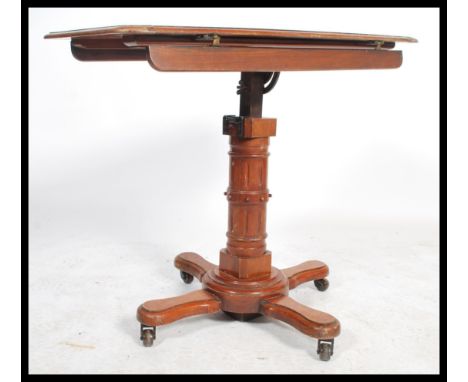 A 19th century Victorian adjustable double sided mahogany reading table lecturn by John Carter of London. Bears manufacturers