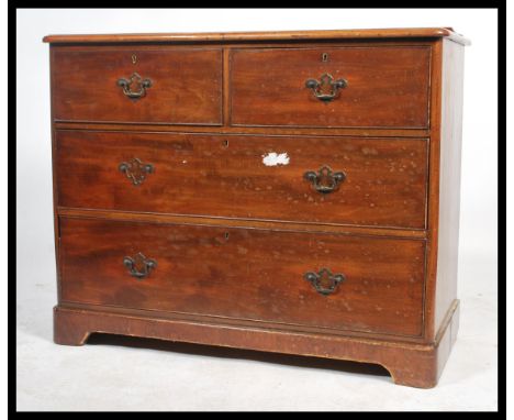 A 19th century mahogany chest of two short and two long drawers, each with brass escutcheon, handle with backplate, raised on