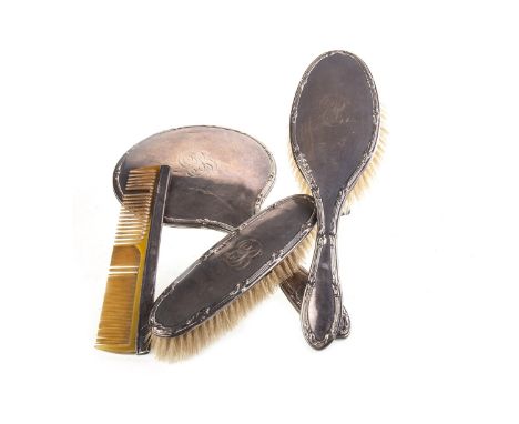 GEORGE V SILVER THREE PIECE VANITY SET, Chester 1919, comprising hand mirror, hair brush, clothes brush and comb (4)