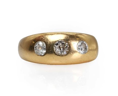 An early 20th-century 18ct gold three stone diamond ring,   with three graduated old mine cut diamonds, totalling approximate