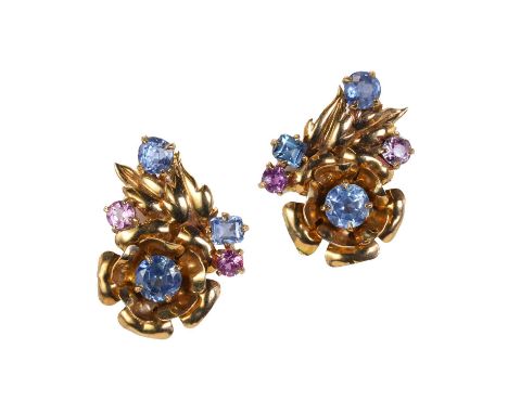 A pair of rose gold varicoloured sapphire clip earrings, c.1950, the floral design mounts claw set with round and step cut li