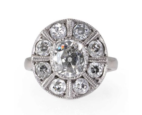 An Art Deco diamond panel ring,  the oval plaque set with an old mine diamond, estimated as approximately 1.75ct, within a su