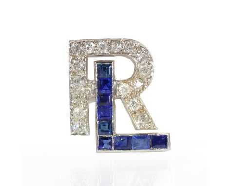An Art Deco sapphire and diamond monogram,  with the letter 'L' channel set with a row of calibré cut sapphires, and the lett