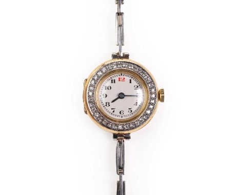 A ladies 18ct gold diamond set mechanical bracelet watch, c.1913,  the circular case with a white enamel dial, Arabic numeral