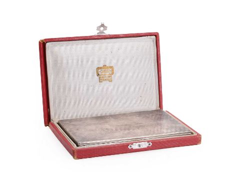 A French Art Deco silver reeded cigarette case,   the rectangular case with gilded interior and thumbpiece. Maker's mark for 