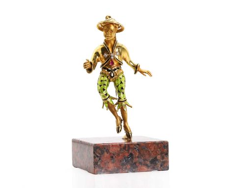 A diamond ruby and enamel sculptural brooch, probably by Nardi, modelled as a tridimensional figure of an Oriental man, with 