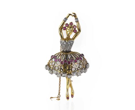 A gold ruby and diamond set Ballerina brooch,  designed as a Ballerina in fifth position, with a ruby set tiara, a corset emb