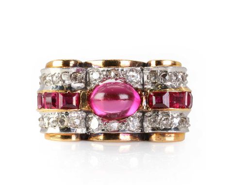 A synthetic ruby and diamond ring, c.1940-1950,  of odeonesque design, centrally set with an oval cabochon synthetic ruby, fl