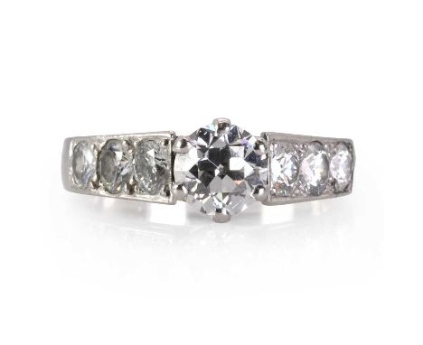 A platinum and diamond ring,  with a principal old cut diamond, estimated as approximately 1.16ct, in a six claw setting, wit