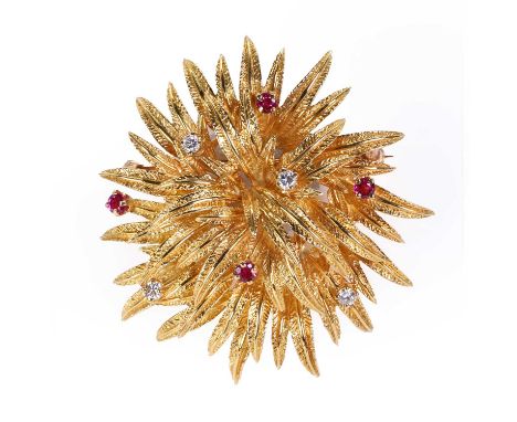 An 18ct gold ruby and diamond brooch, by Tiffany & Co., in a flower head style, set with four round brilliant cut diamonds an