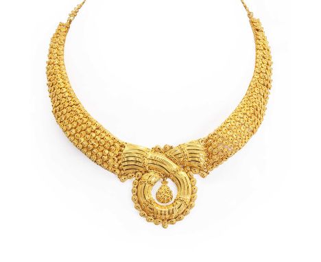 A high carat intricate gold necklace, the chain graduated with fine filigree work and gold beading, onto a woven design with 