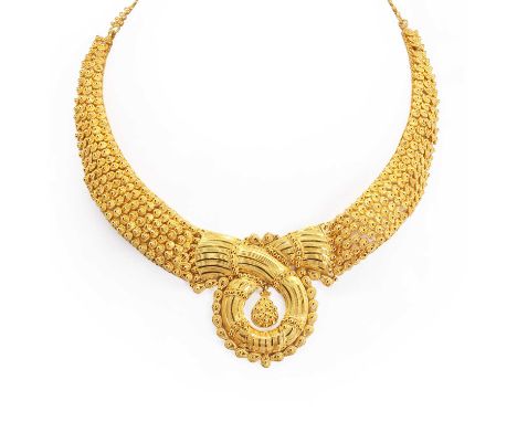 A high carat intricate gold necklace, the chain graduated with fine filigree work and gold beading, onto a woven design with 