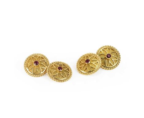 A pair of 18ct gold ruby set chain cufflinks, double-sided, each plate with a round cut ruby rub set to the centre of a textu