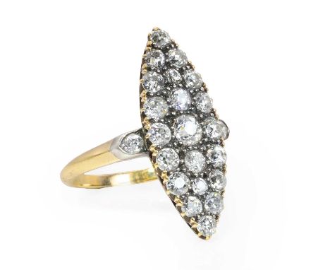 An Edwardian diamond marquise form ring,  the marquise shaped plaque set with twenty one old round and cushion cut diamonds, 