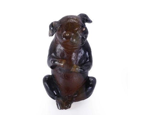 A hardstone model of a pig, probably by Fabergé, c.1900, realistically carved from banded agate, sitting upright and smiling,
