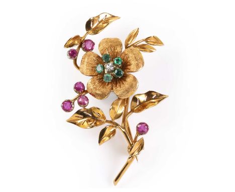 An emerald, diamond and ruby floral brooch, the central flower moves within the setting, and with textured petals, decorated 