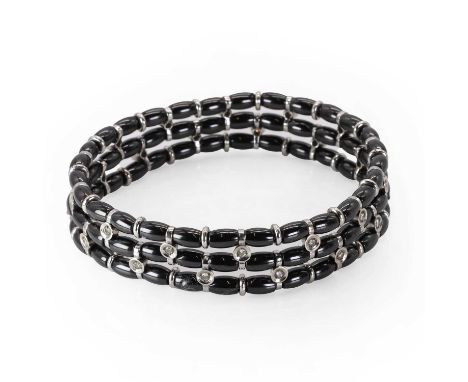 A white gold diamond and black ceramic bead bracelet, by Jarretiere, with round brilliant cut diamonds, all spitch set to whi