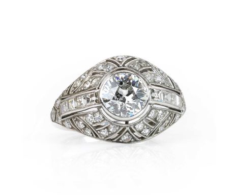 A French Art Deco platinum and diamond bombé ring,   the domed ring head with an old European diamond rub set to the centre, 