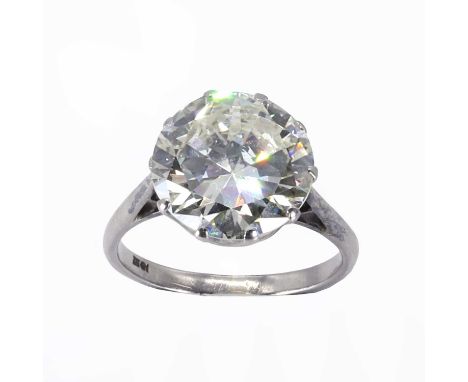 An impressive single stone diamond ring,  a round brilliant cut diamond, estimated as approximately 6.20ct, claw set to a rex