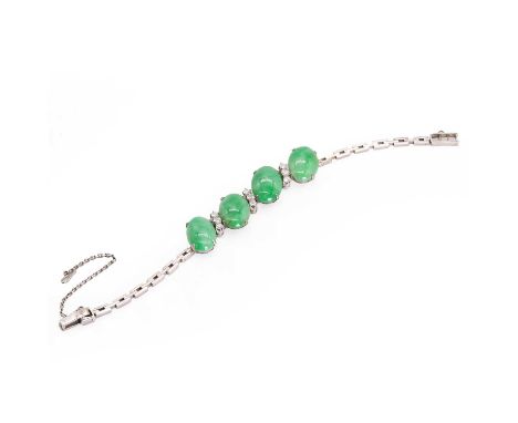 A jade and diamond bracelet, with four principal oval jade cabochons, claw set, each alternating with three round brilliant c