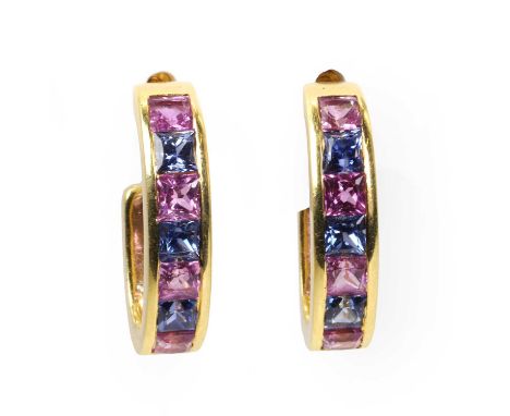 A pair of 18ct gold pink and blue sapphire cuff earrings, by Mappin & Webb, with a line of square cut pink and blue sapphires