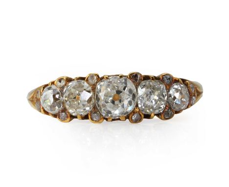 A late Victorian five stone diamond ring,  with five graduated old mine cut diamonds, the central one estimated as approximat